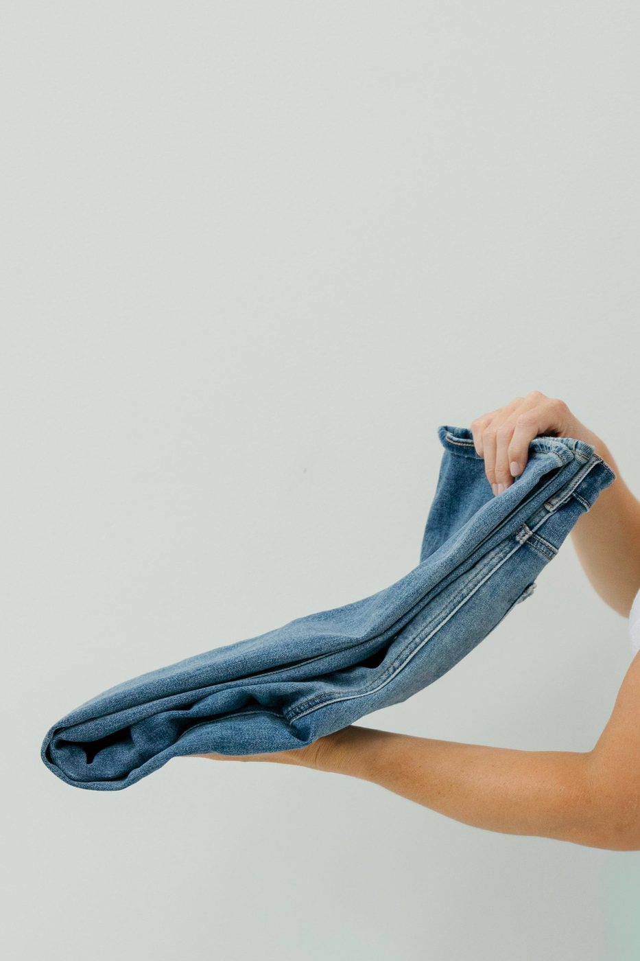 Folding a pair of jeans for an organized closet